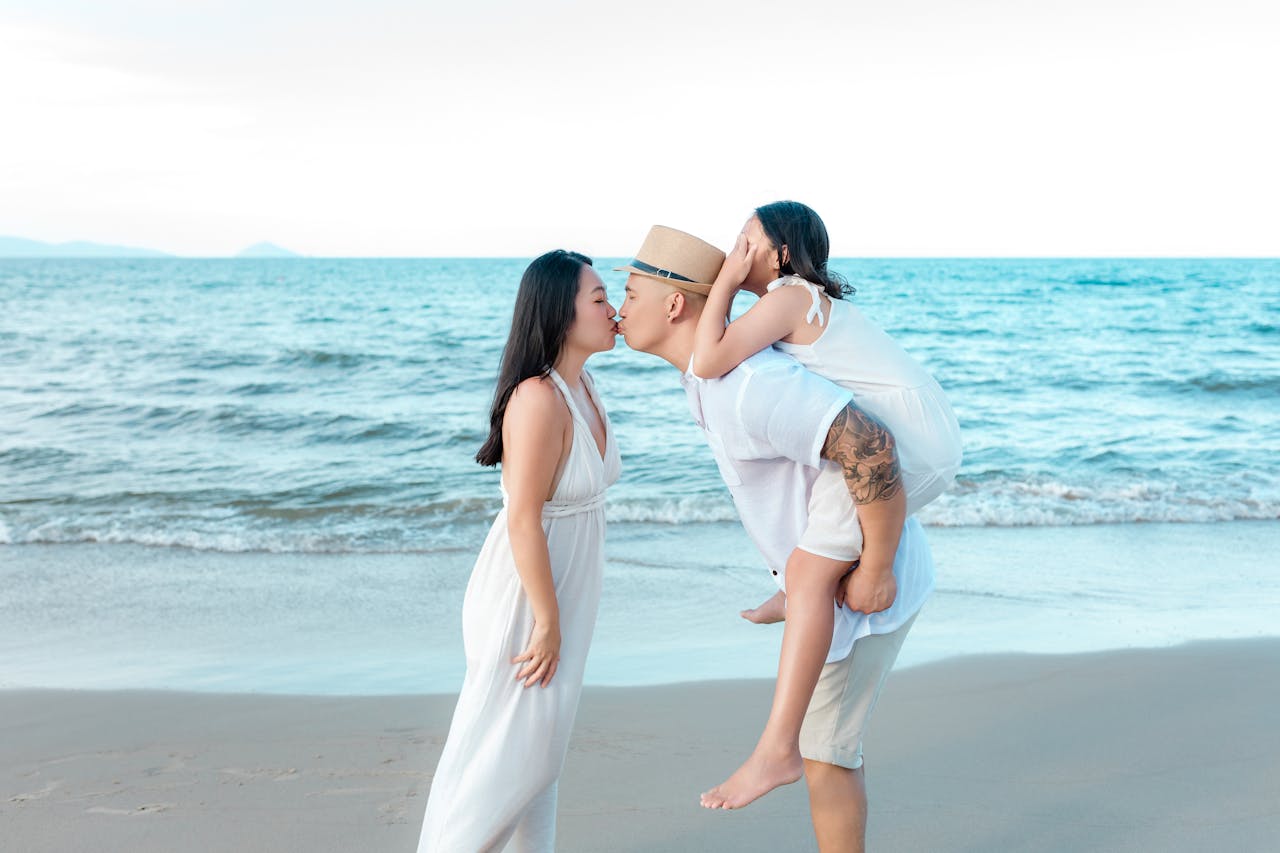 A joyful family moment captured on the beach in Hoi An, Vietnam.